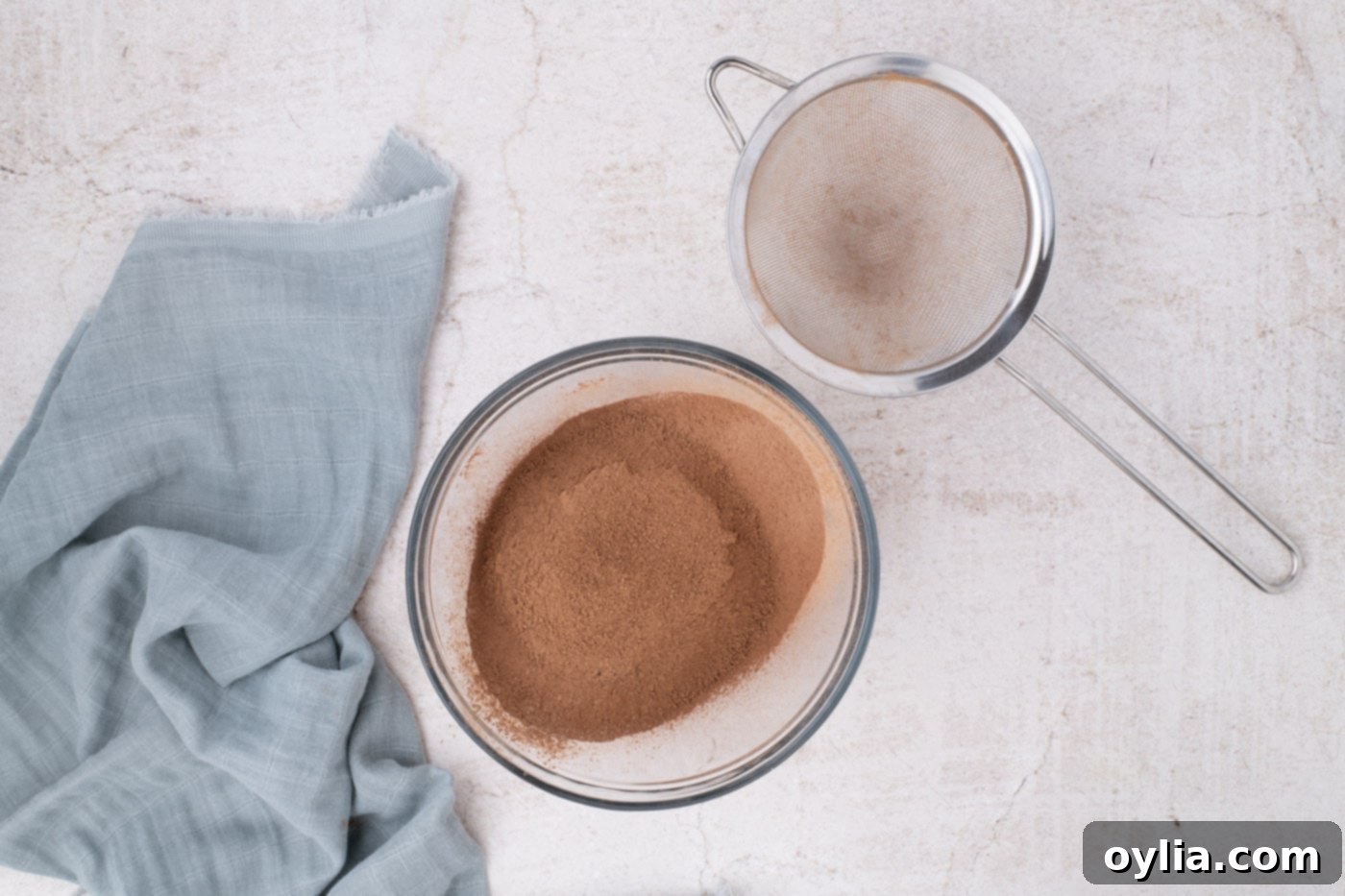 Sifted flour, cocoa powder, and salt in a mixing bowl, ready to be combined with wet ingredients.
