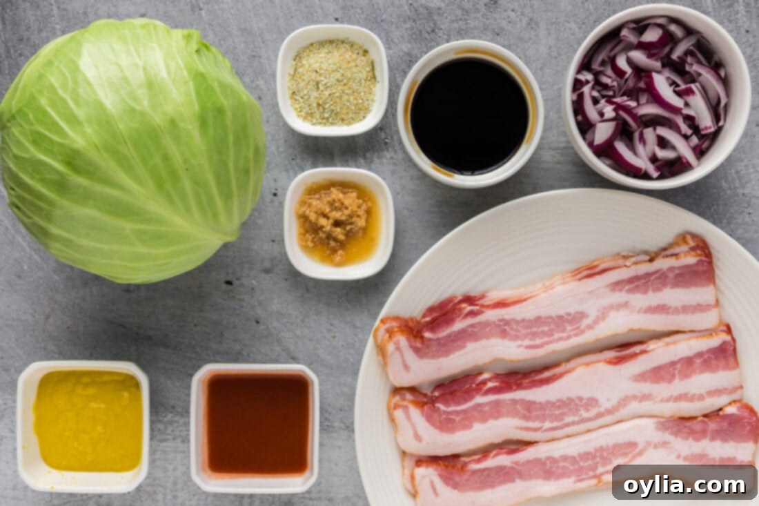 Ingredients for Spicy Fried Cabbage laid out on a cutting board, including bacon, cabbage, onion, and various sauces.