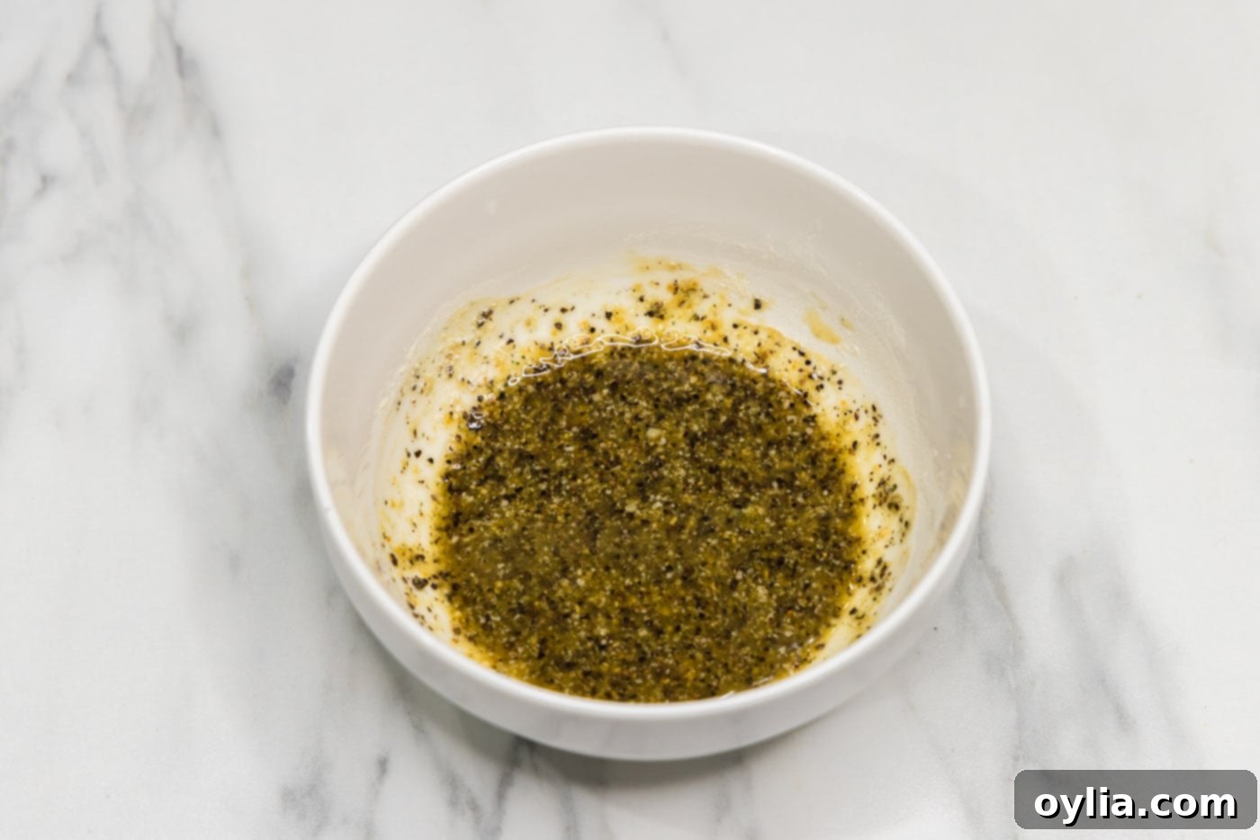 seasonings mixed with olive oil in a small bowl