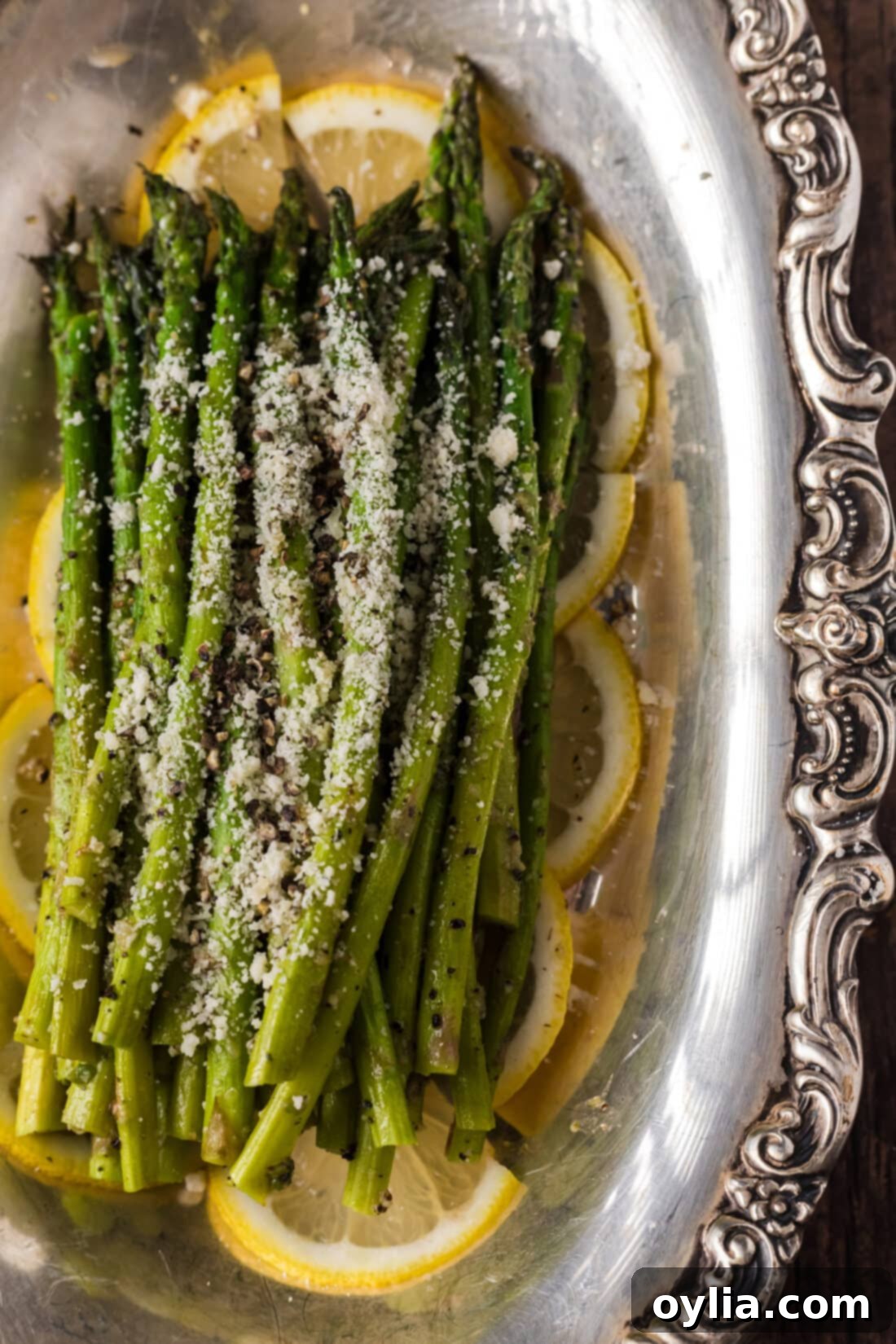 Tender Steamed Asparagus 9 Close up photo of Steamed Asparagus topped with parmesan
