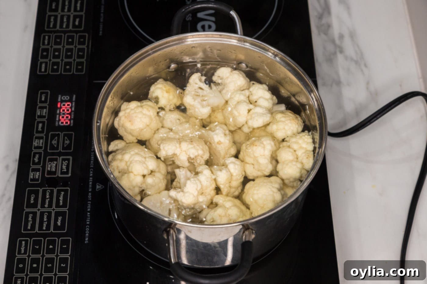 cauliflower florets boiling in water