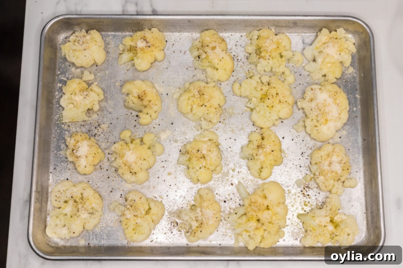 smashed cauliflower with parmesan cheese and seasonings