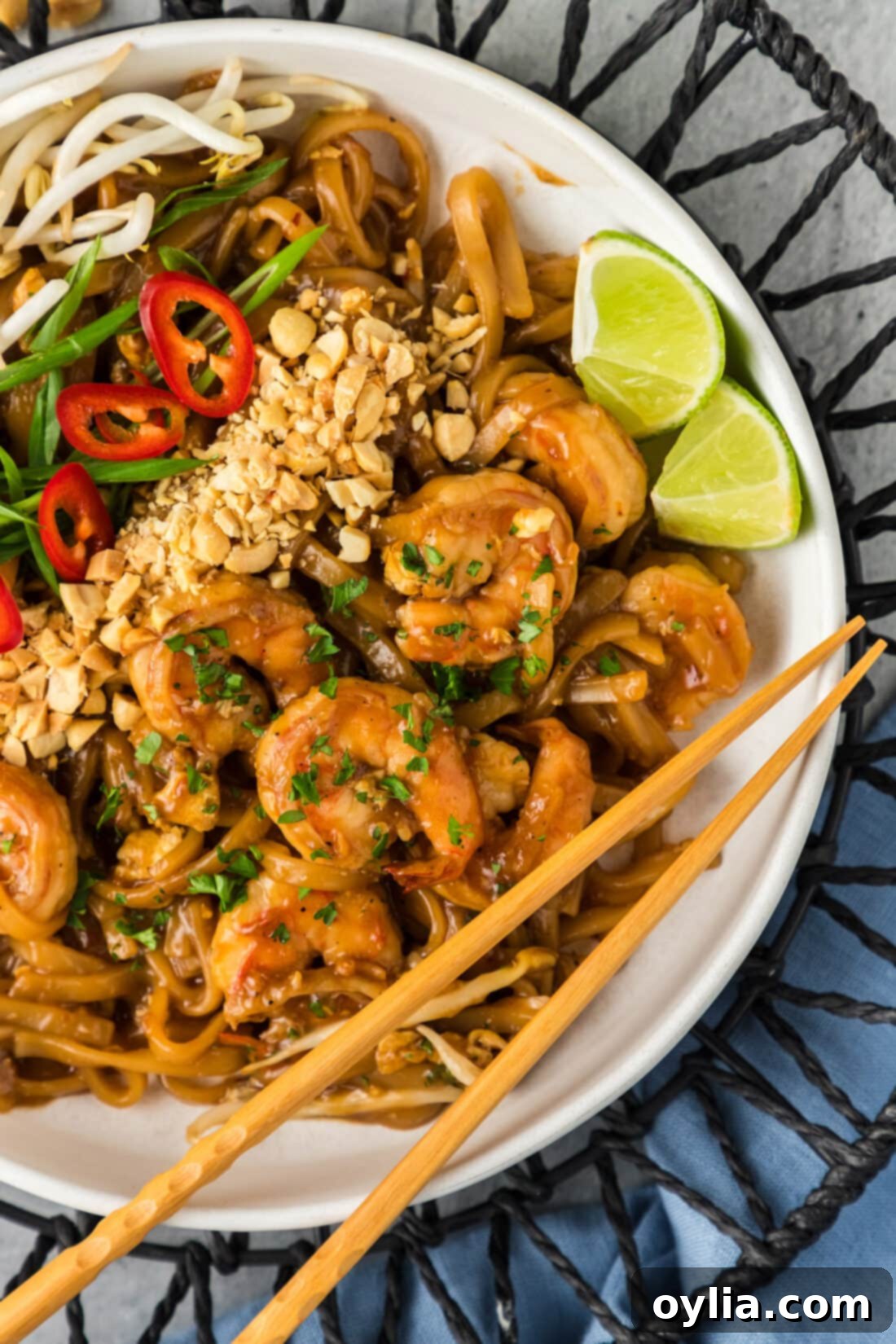 Flavorful Shrimp Pad Thai 3 Close up photo of Shrimp Pad Thai in a bowl with chopsticks resting on the bowl