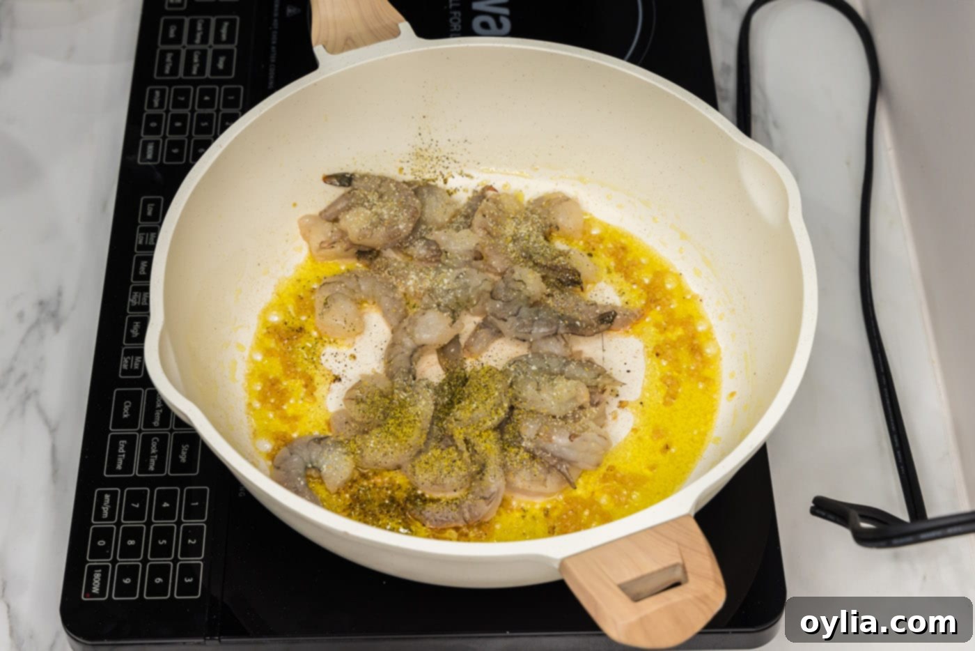 shrimp in a skillet with olive oil and garlic