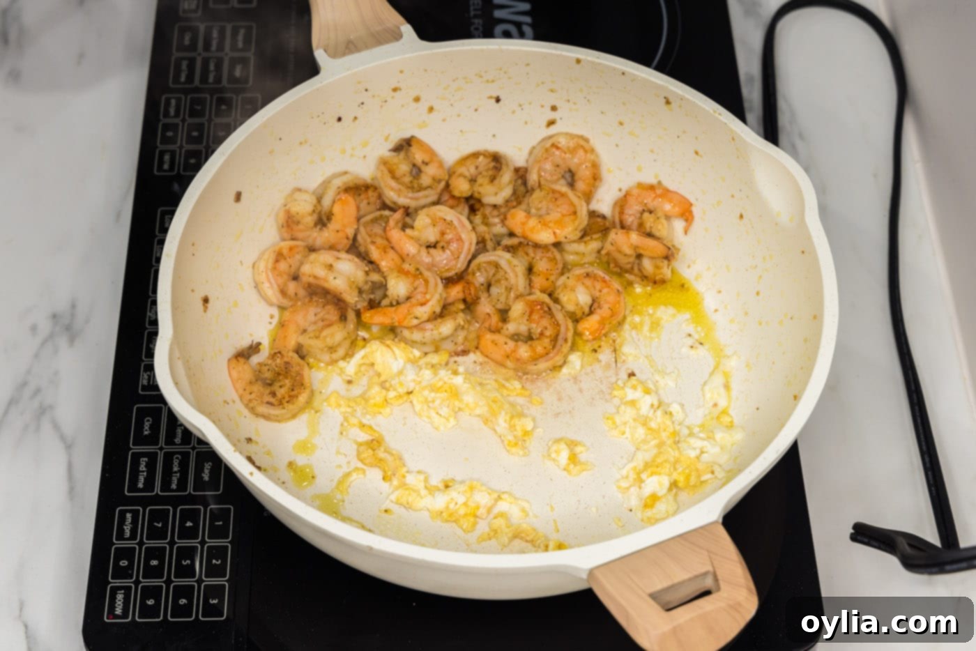 scrambled egg in a skillet with shrimp