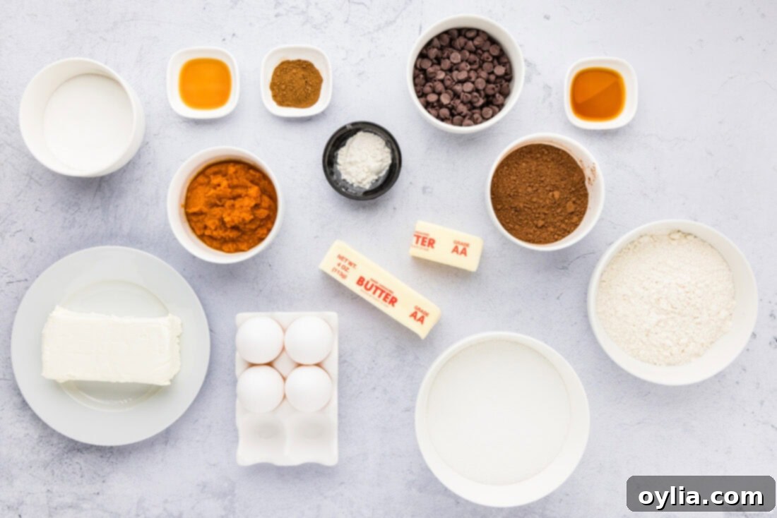 Spiced Pumpkin Swirl Cheesecake Brownies 4 All the necessary ingredients for baking Pumpkin Cheesecake Brownies laid out on a counter