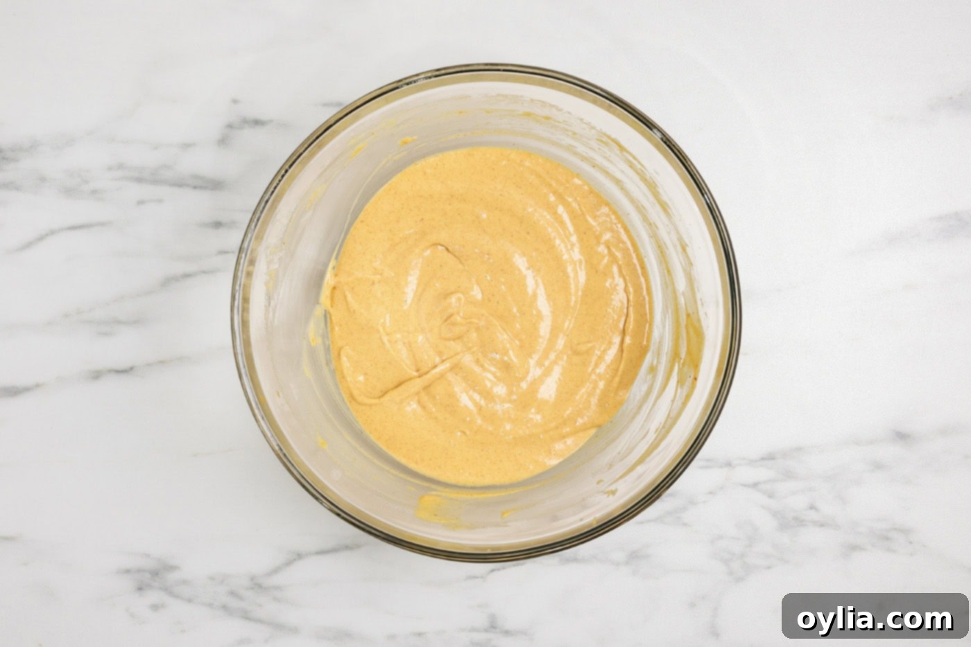 Spiced Pumpkin Swirl Cheesecake Brownies 5 Pumpkin cheesecake batter in a mixing bowl, ready for assembly