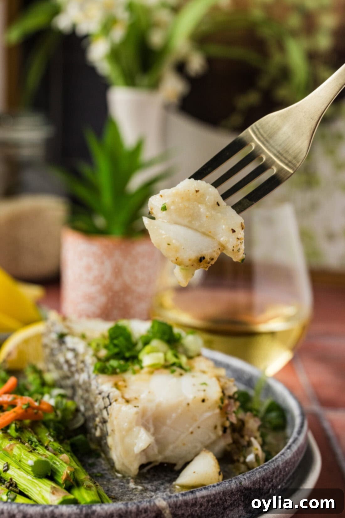 Piece of Steamed Chilean Sea Bass on a fork