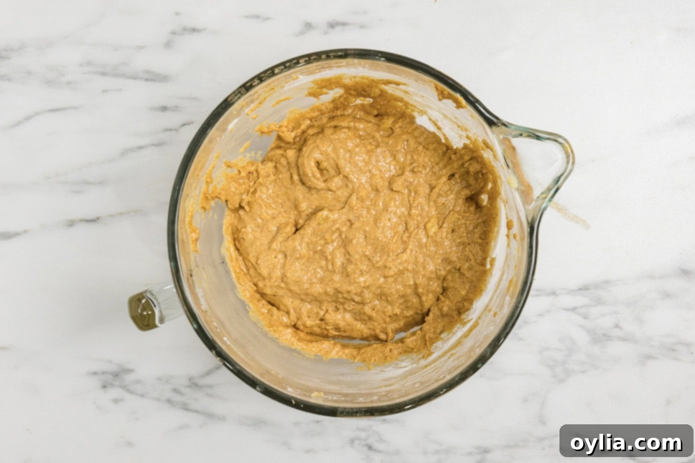 pumpkin banana bread batter resting in a bowl