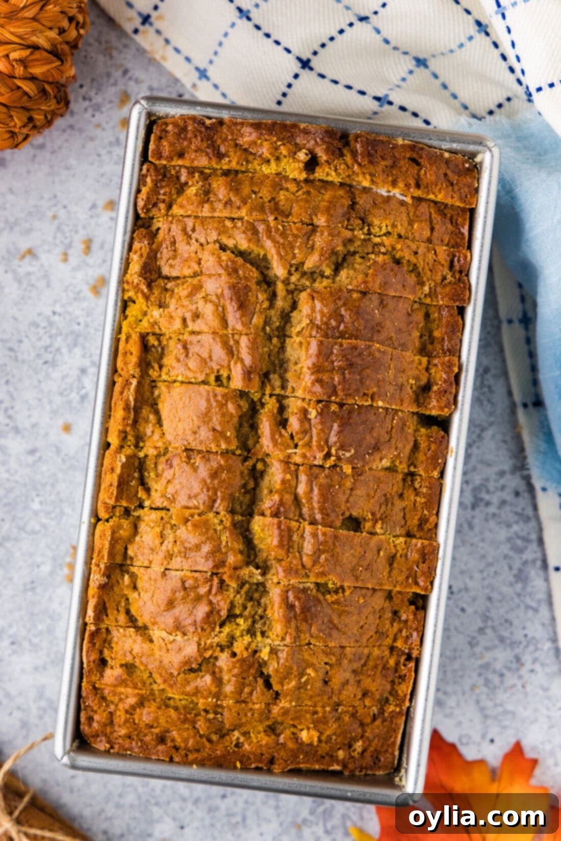 Golden Spiced Pumpkin Banana Loaf 14 Pumpkin Banana Bread cut into perfect slices in a loaf pan, ready to serve