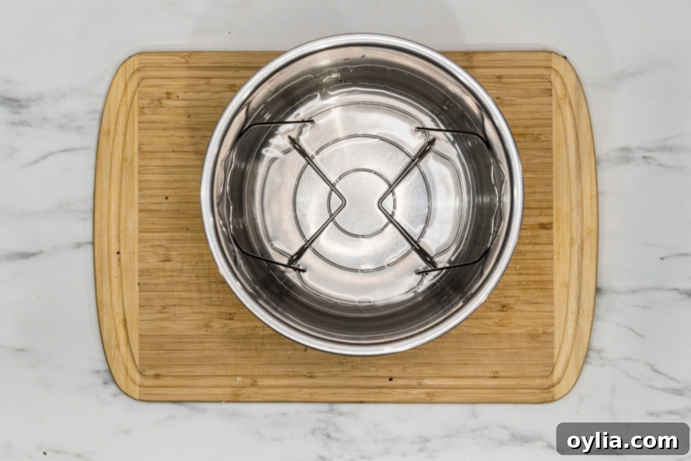 Tender-Crisp Instant Pot Asparagus 7 water in the basket of an instant pot