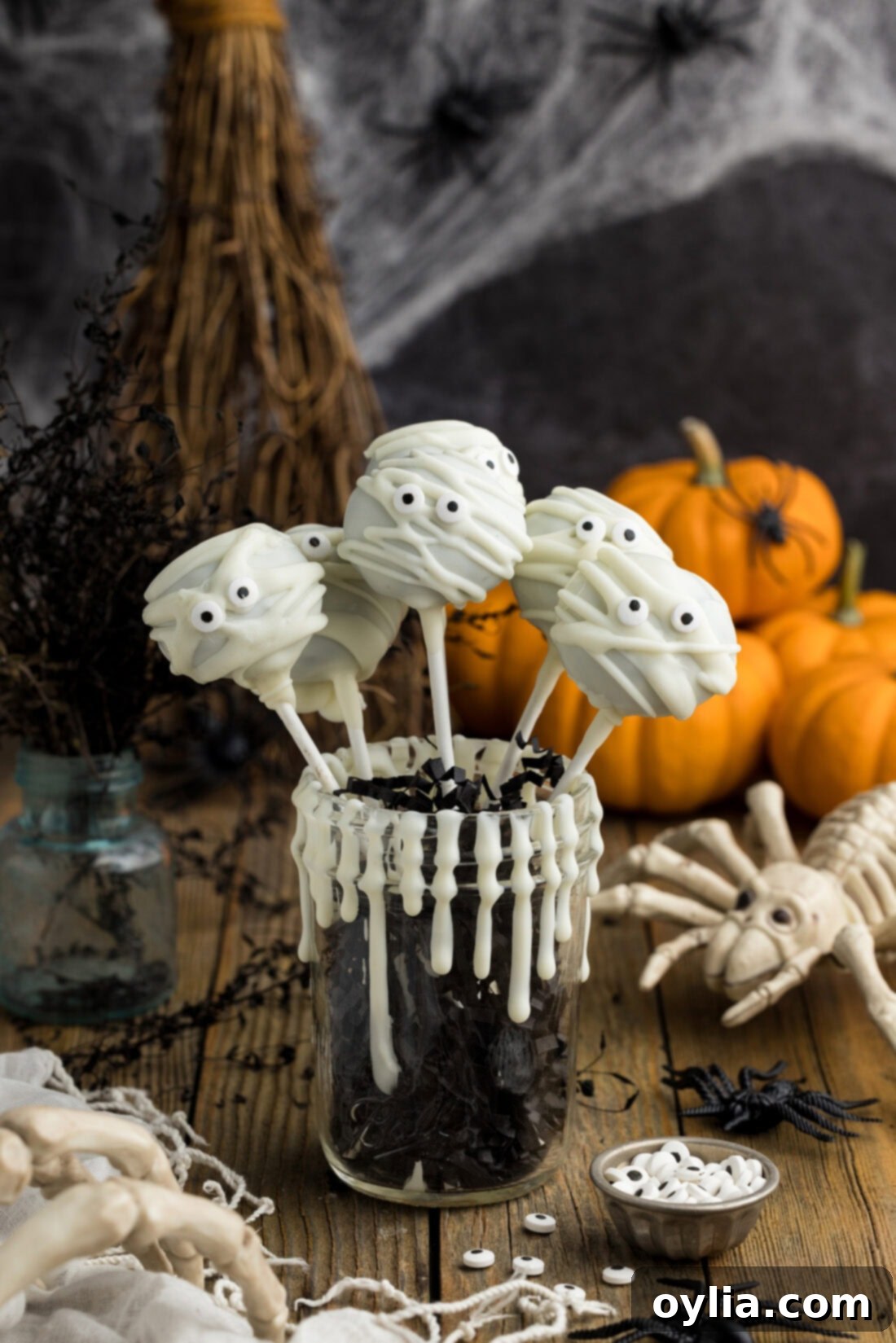 Mummy Pops resting in a cup, ready to be enjoyed for Halloween
