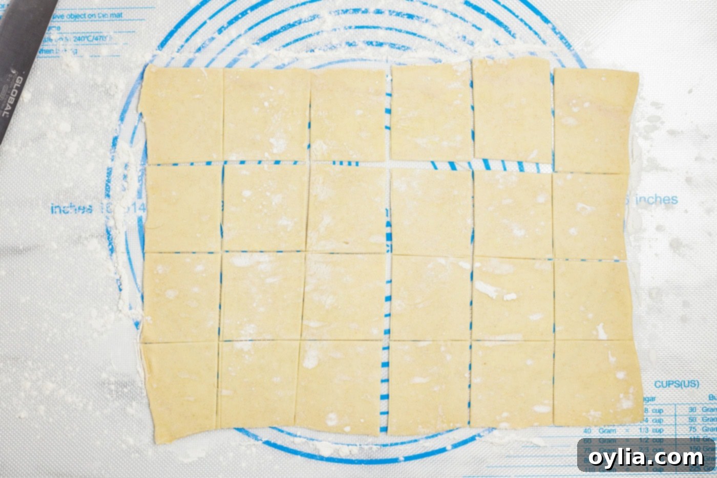 puff pastry sheet on a floured surface cut into squares