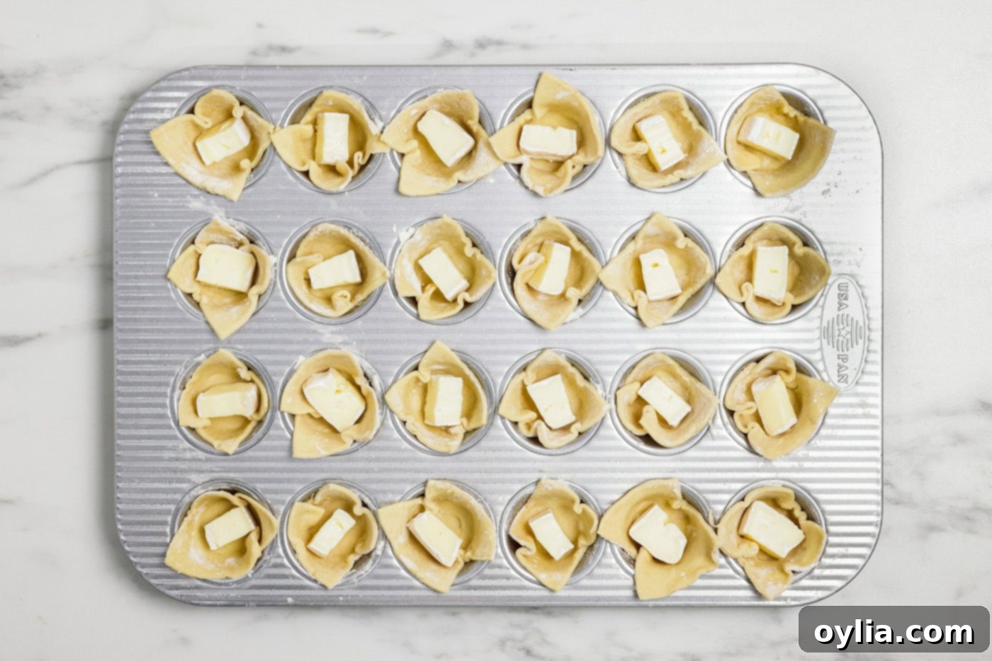 cubes of brie inside puff pastry squares