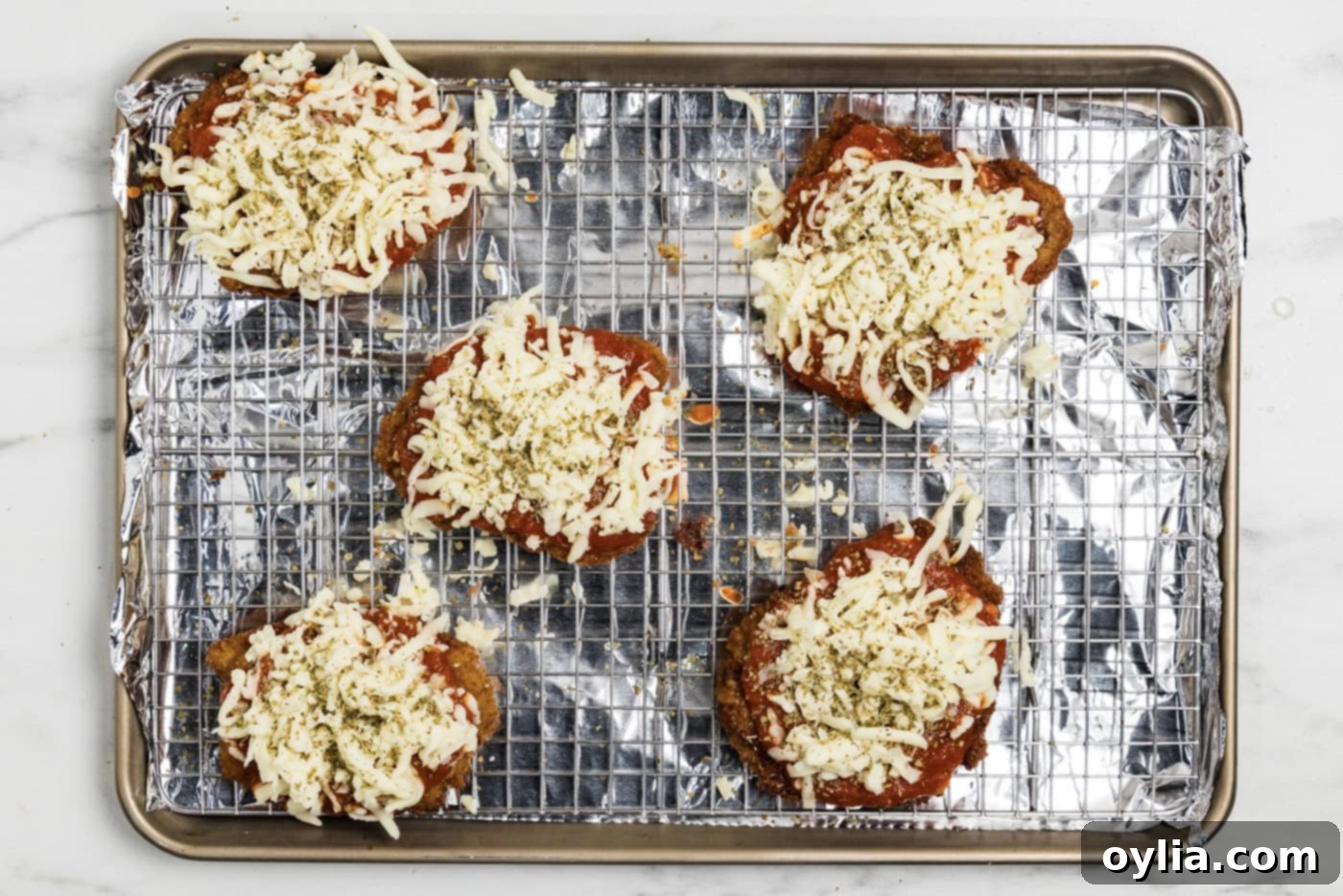 Mozzarella cheese on top of marinara fried veal cutlets