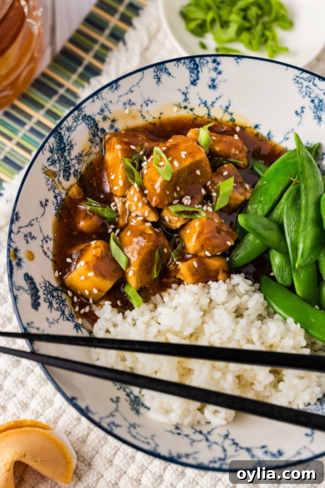 Instant Pot Honey Garlic Chicken served over rice with peas
