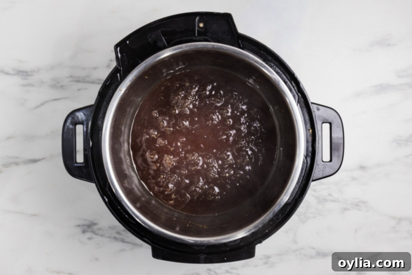 Honey garlic sauce boiling in the Instant Pot