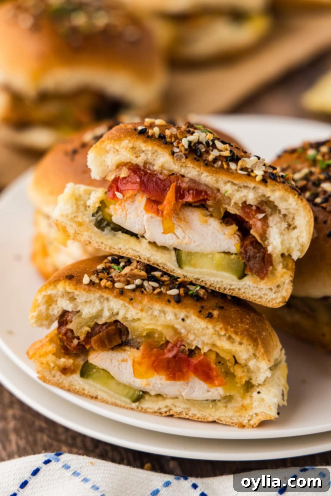 Gouda Chicken Sliders cut in half stacked on top of each other