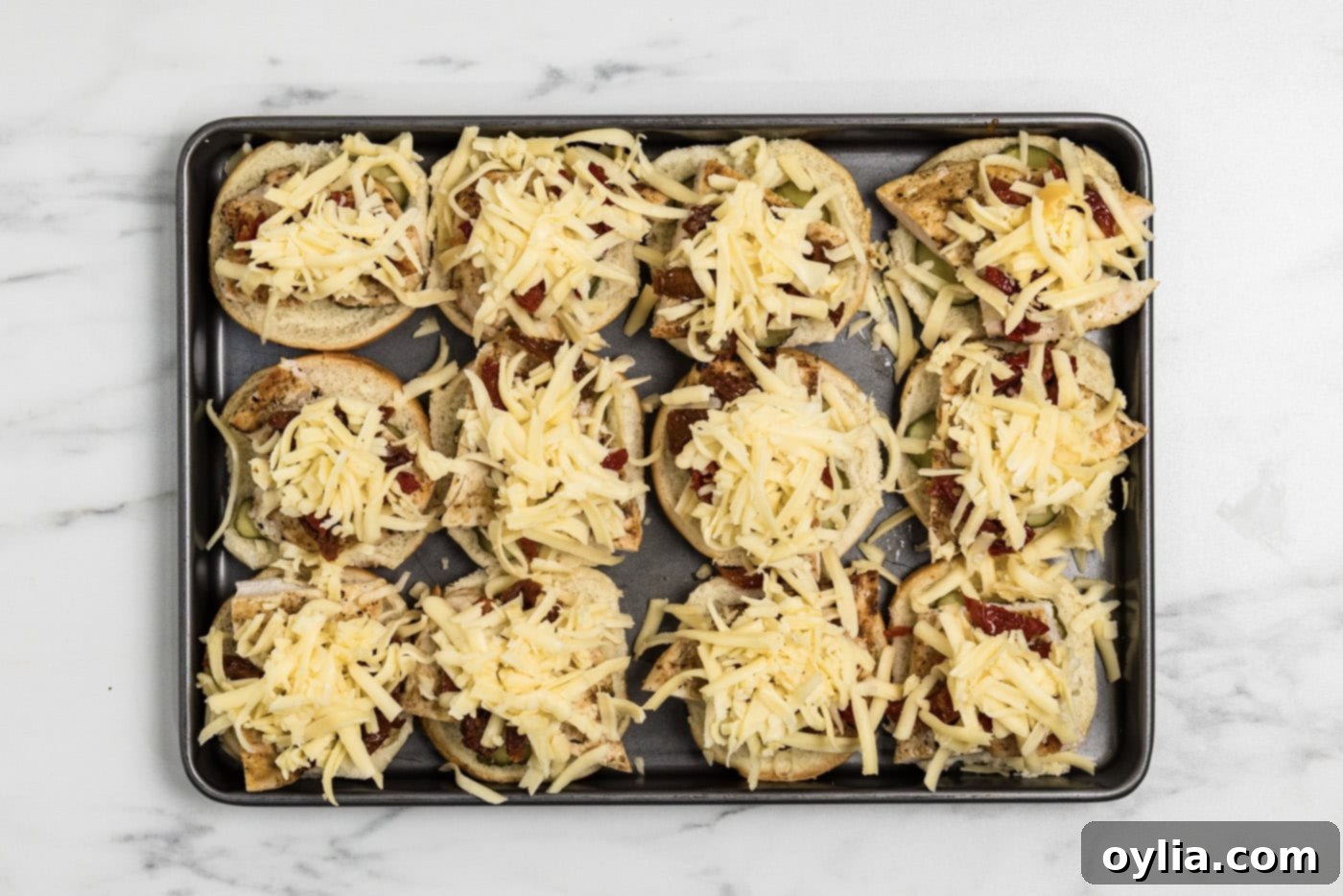 shredded gouda cheese over top chicken sliders