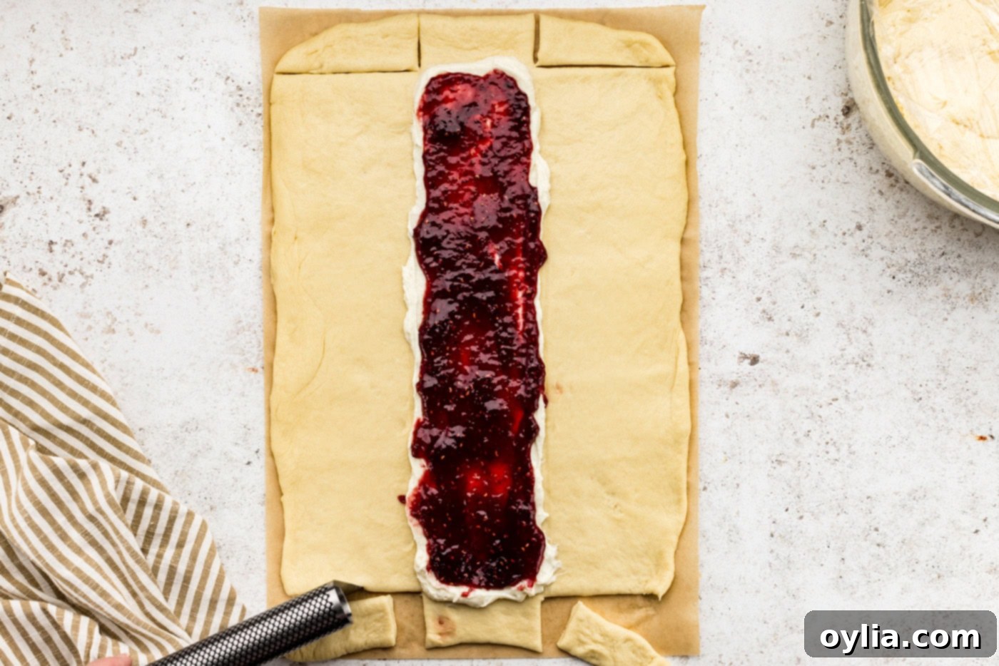 Strips cut from sides of dough to make braids