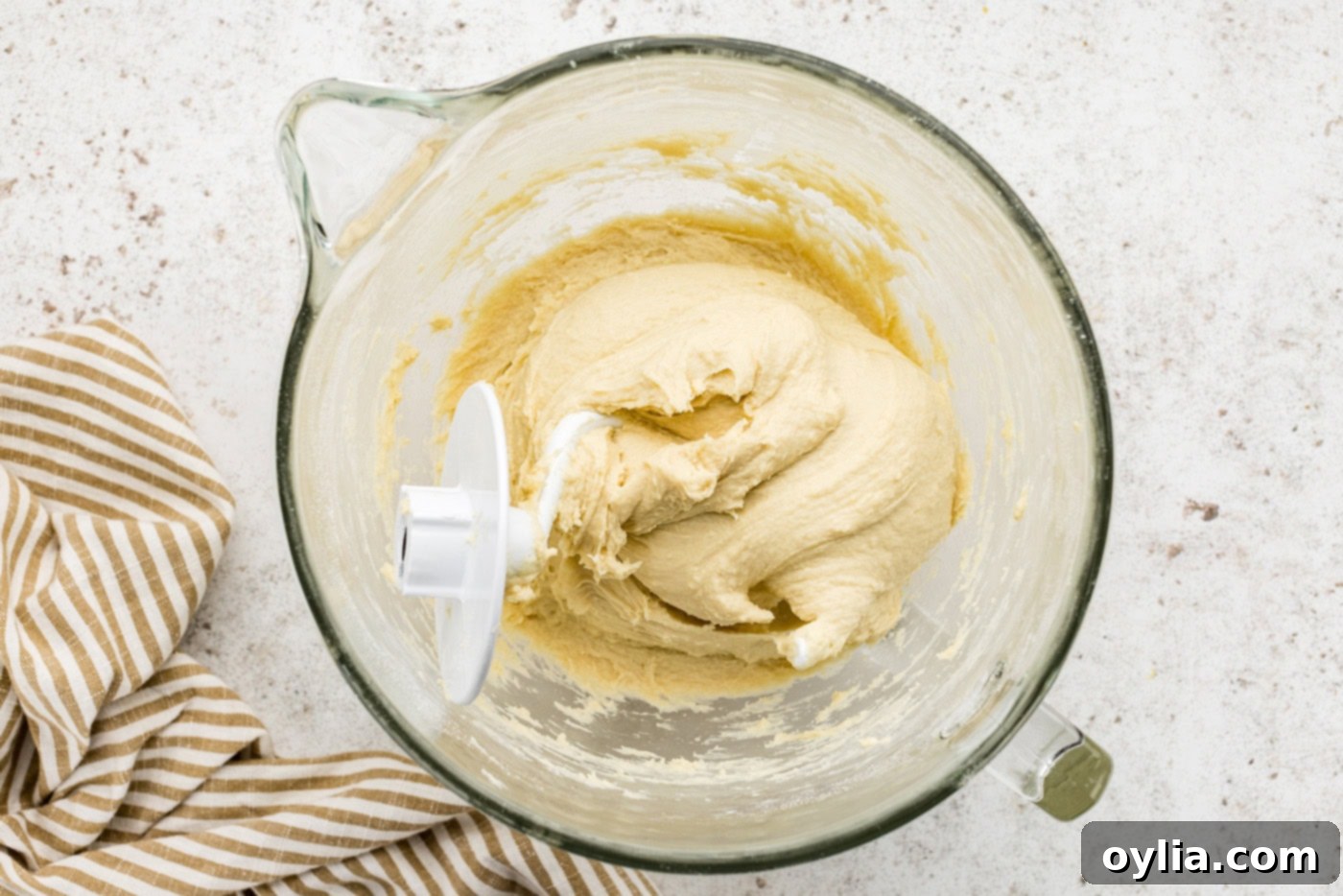Breakfast danish dough in a stand mixer bowl with hook attachment
