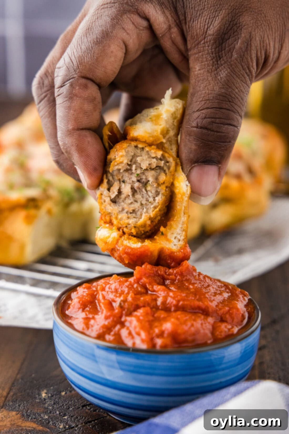 Meatball Slider Dipped in Marinara Sauce