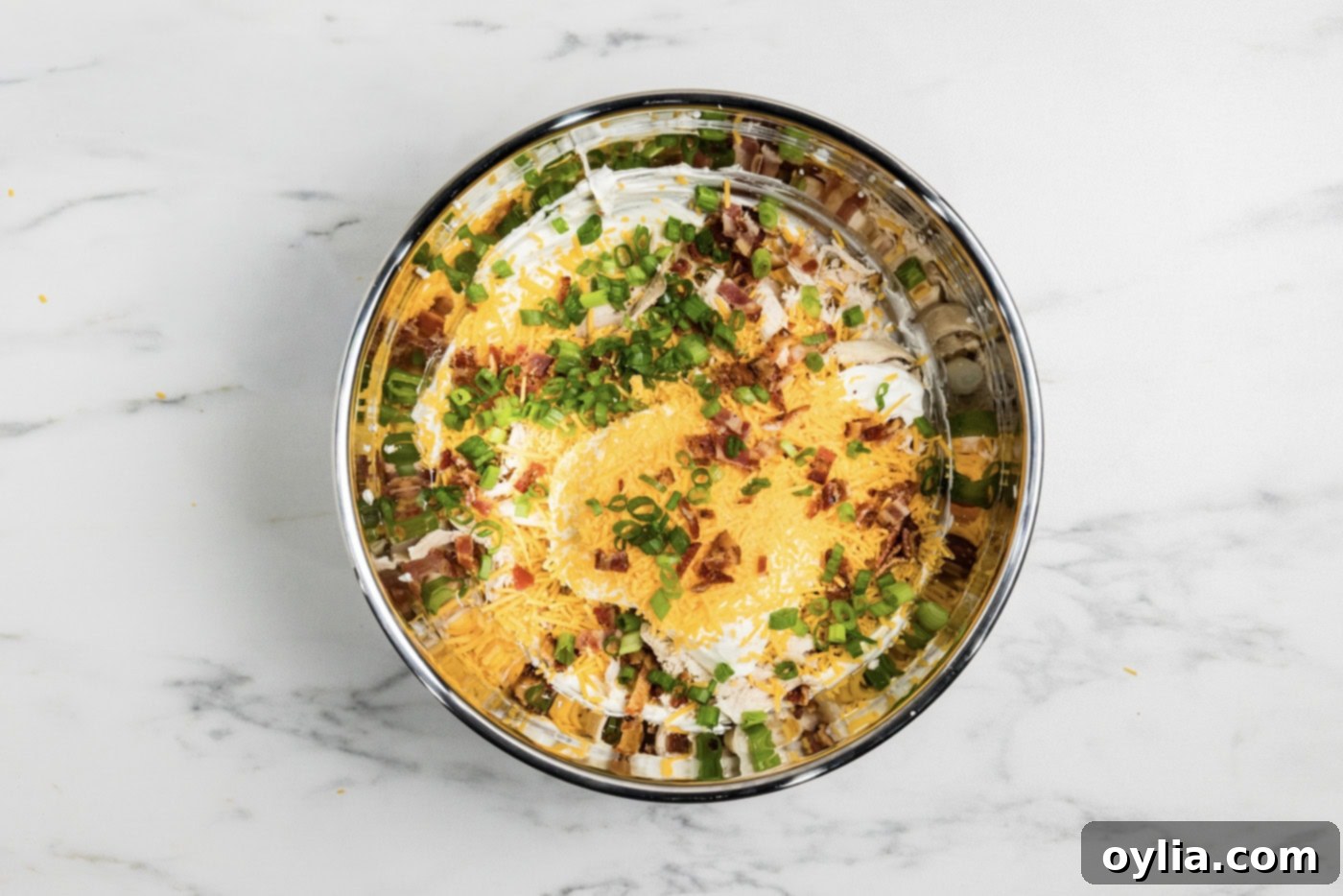 Chicken bacon ranch dip ingredients together in a mixing bowl - Ready to bake!