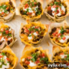 Close up photo of Taco Cups resting on parchment paper
