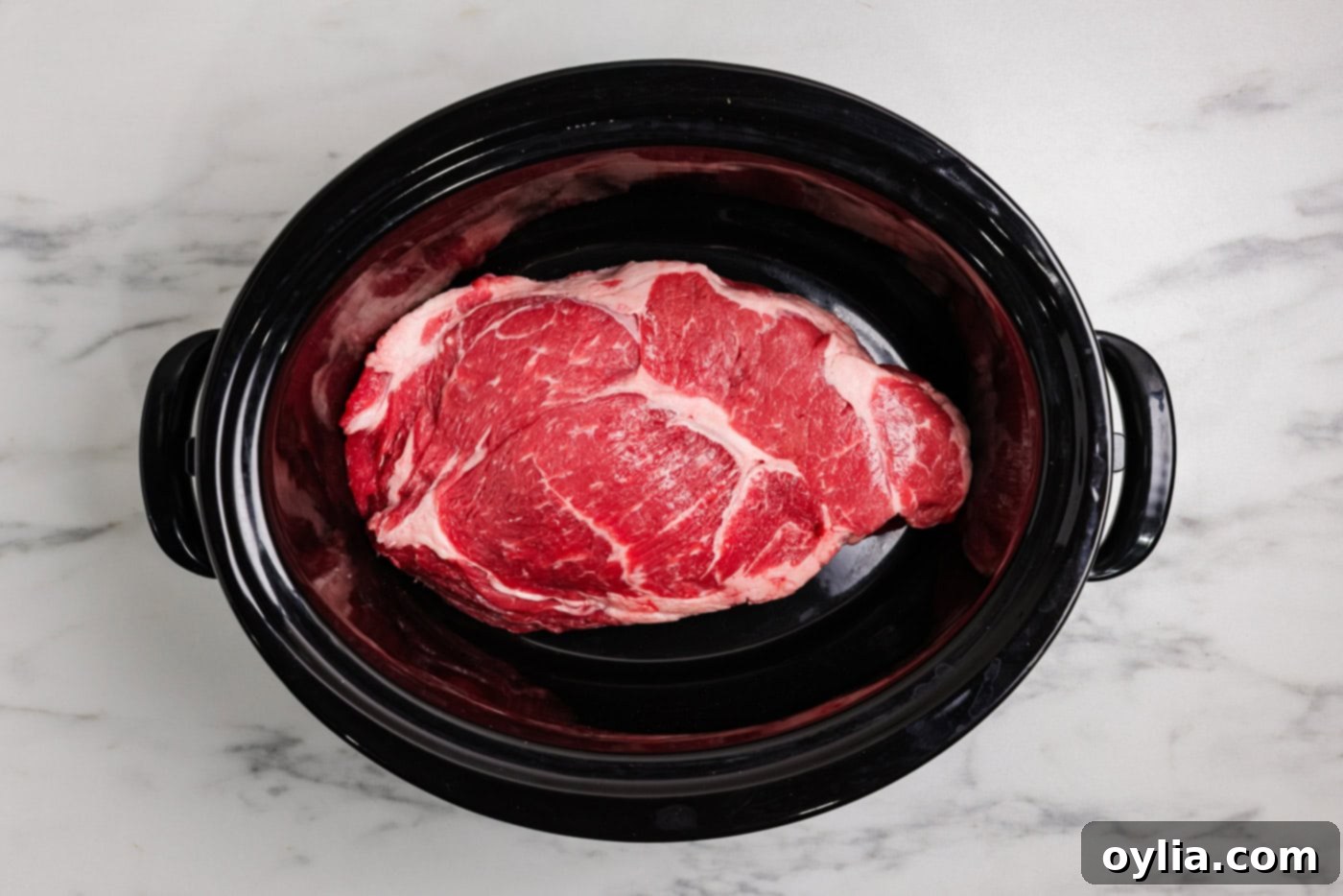 Thawed chuck roast in a crockpot