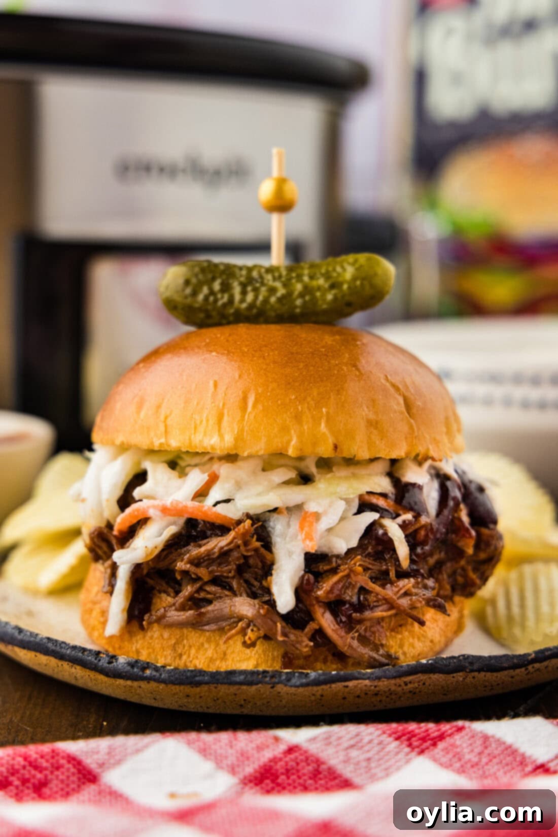 Crockpot BBQ Beef Sandwiches plated with potato chips