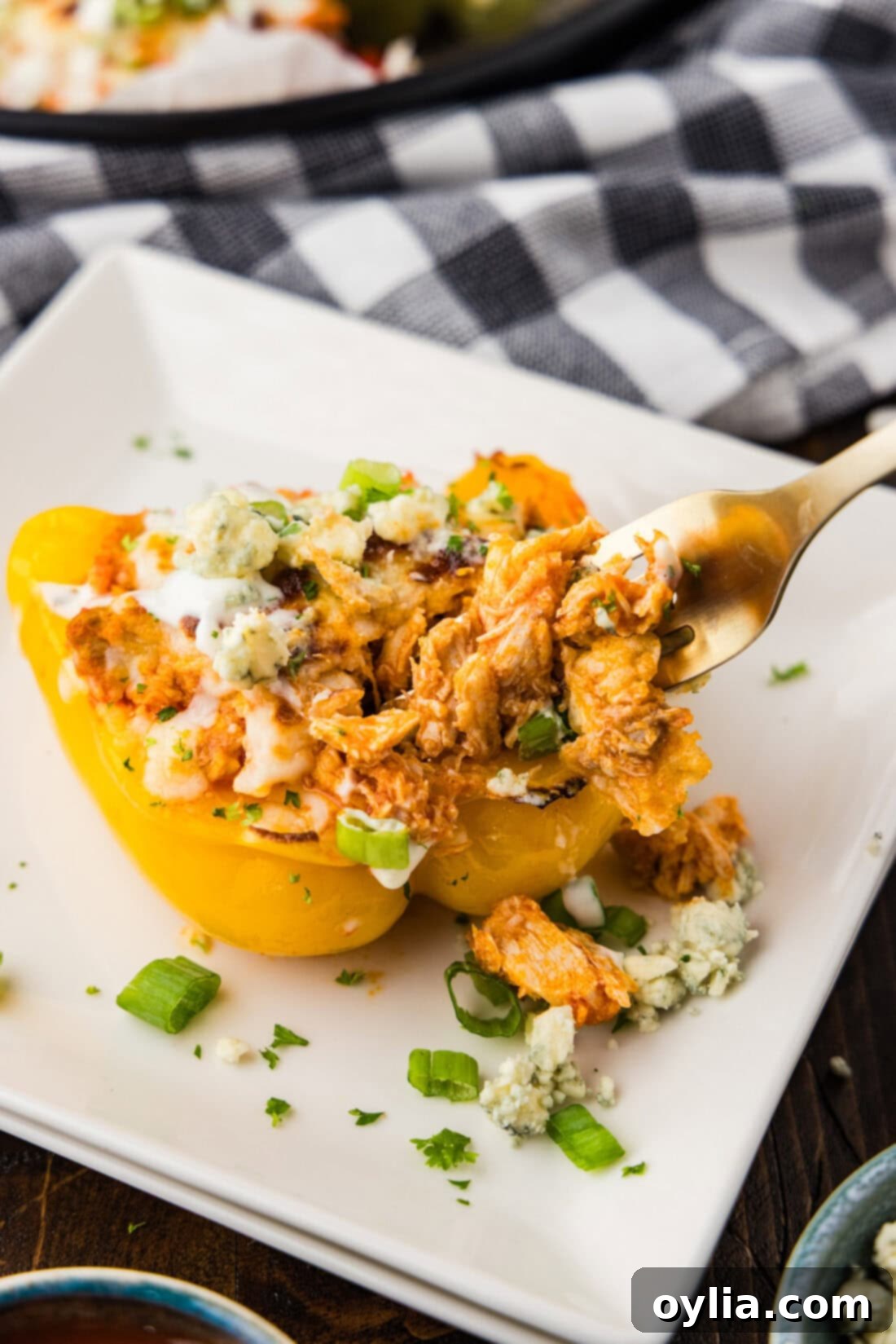 Buffalo Chicken Stuffed Bell Peppers 11 Fork picking up a piece of Buffalo Chicken Stuffed Pepper