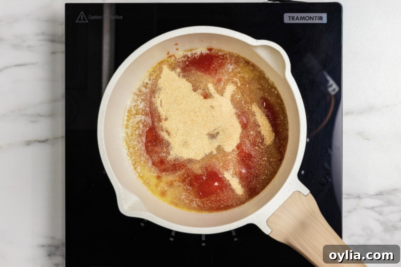 Hot sauce, garlic and onion powder, and butter in a saucepan