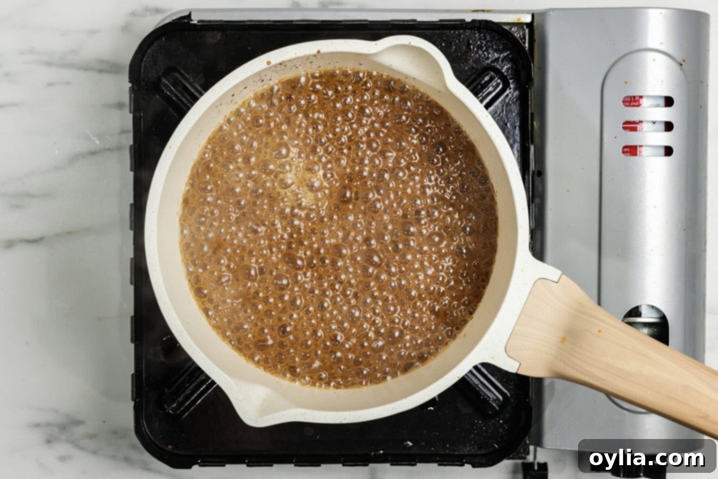 Gravy simmering in a saucepan